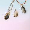 Montana Agate Drop in 18ct Yellow Gold with silver box chain. shown on gradient blue-to-pink background.