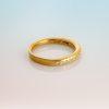 18ct yellow gold ring with eleven small round white diamonds set in a row.