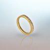 18ct yellow gold ring with eleven small round white diamonds set in a row.