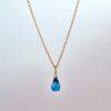 Faceted London blue topaz briolette pendant on 18ct yellow Fairtrade gold chain.
