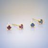 two pairs of 18ct yellow gold stud earrings with claw-set gemstones - red ruby and blue sapphire