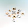 Group shot of small hinged hoop earrings in platinum, 18ct yellow gold, and 18ct rose gold, arranged on a soft gradient background and showing earring posts.
